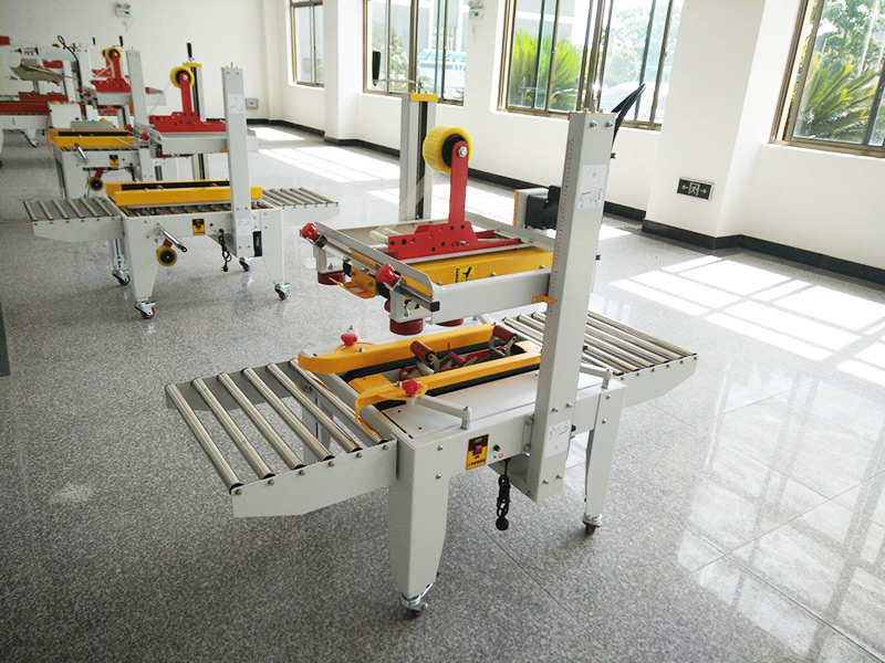 js-fx500c 上下(xià)驅動手(shǒu)動(dòng)折蓋膠帶(dài)封箱(xiāng)機